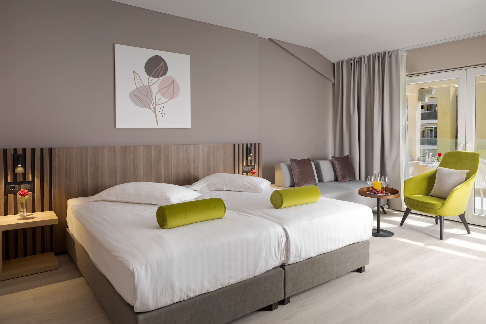 a room with two beds and a table