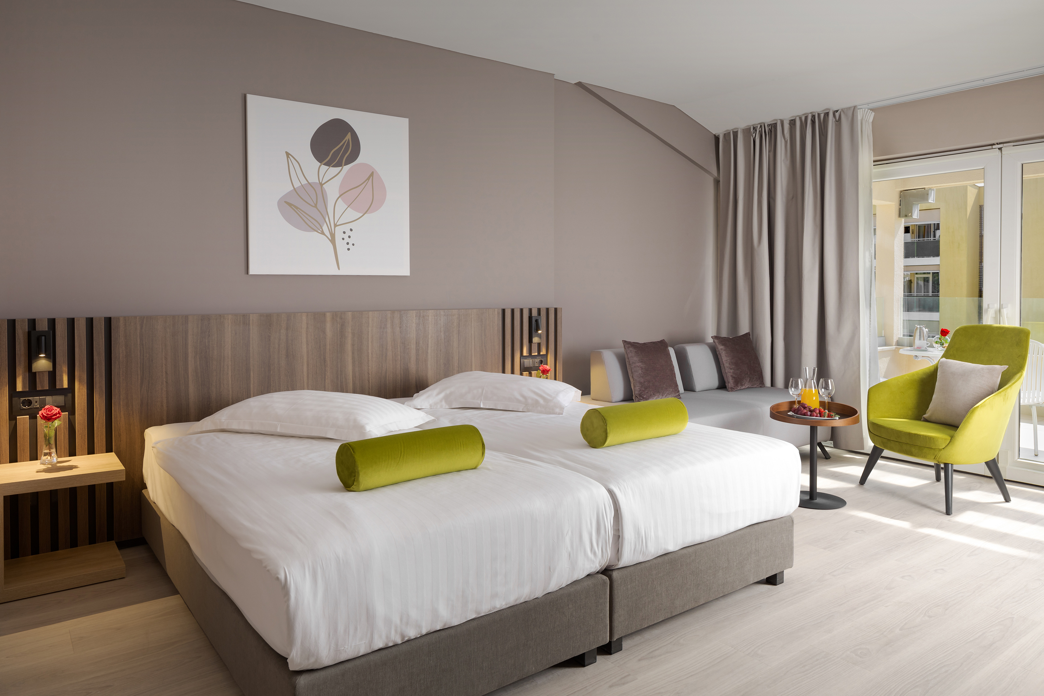 a room with two beds and a table