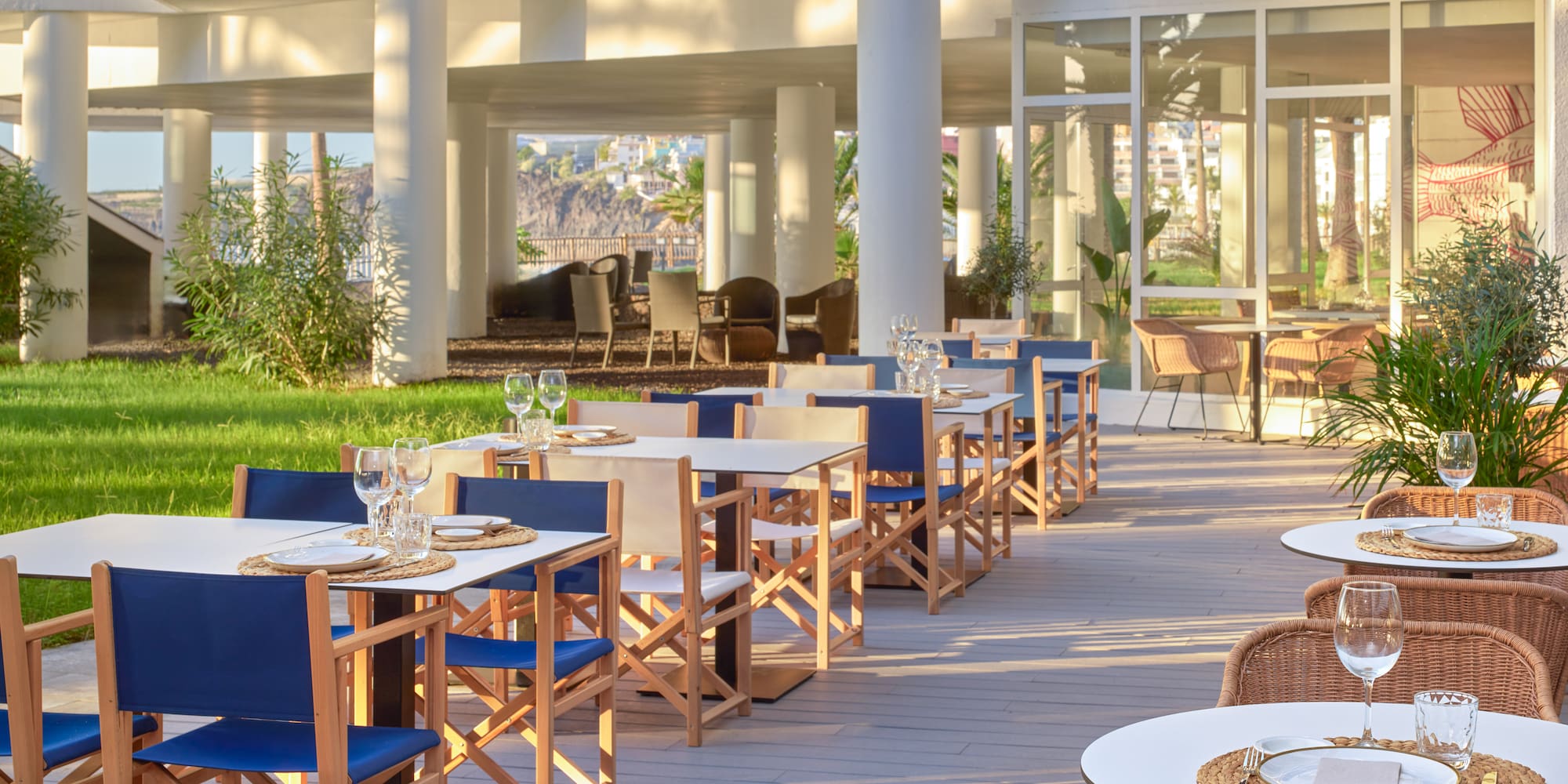 a patio with tables and chairs
