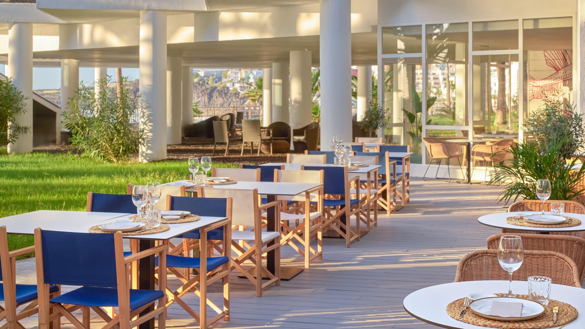 a patio with tables and chairs