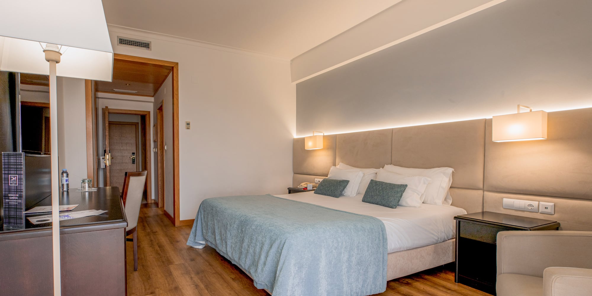 a bedroom with a bed and a table