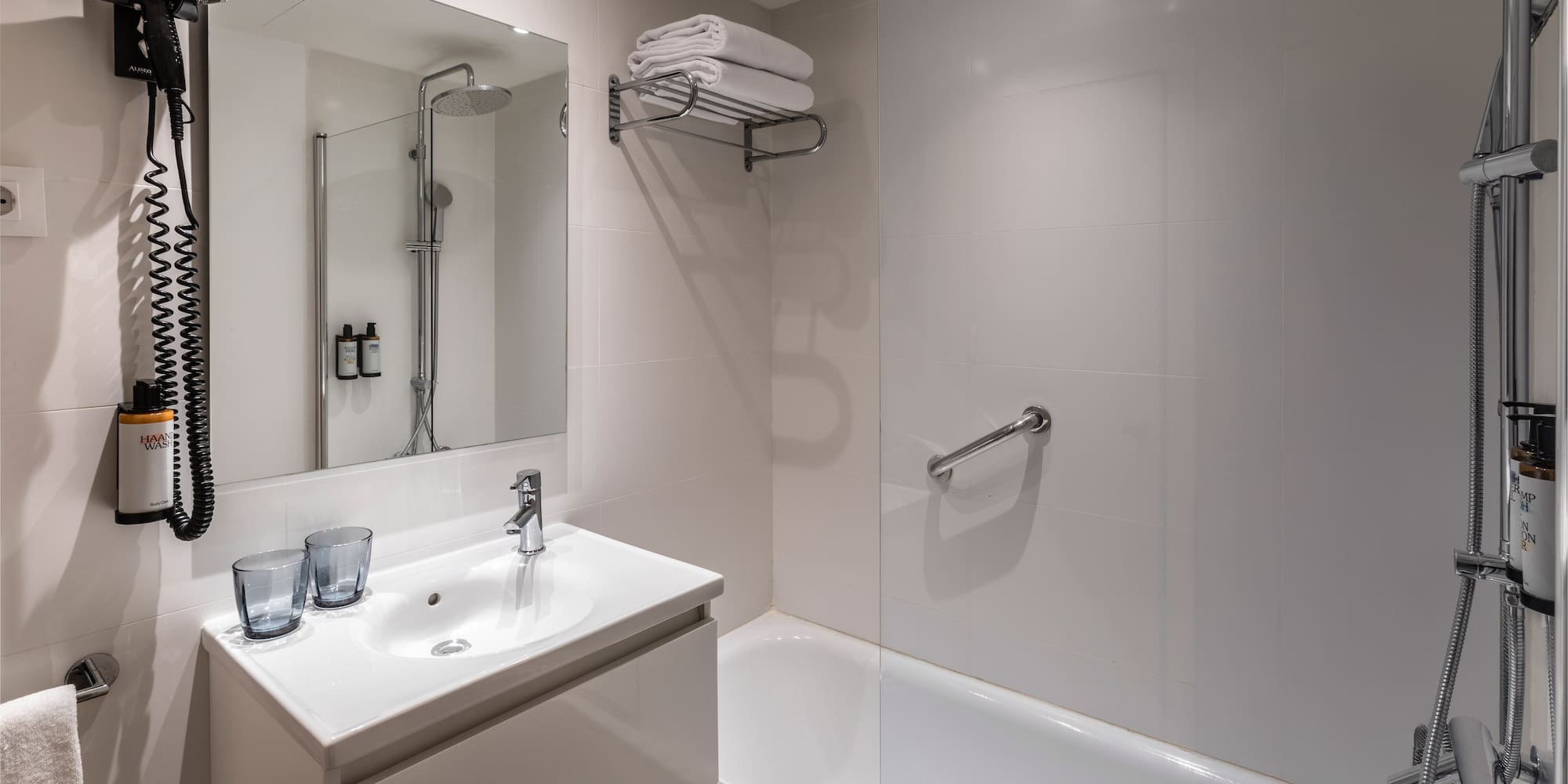 a bathroom with a shower and sink