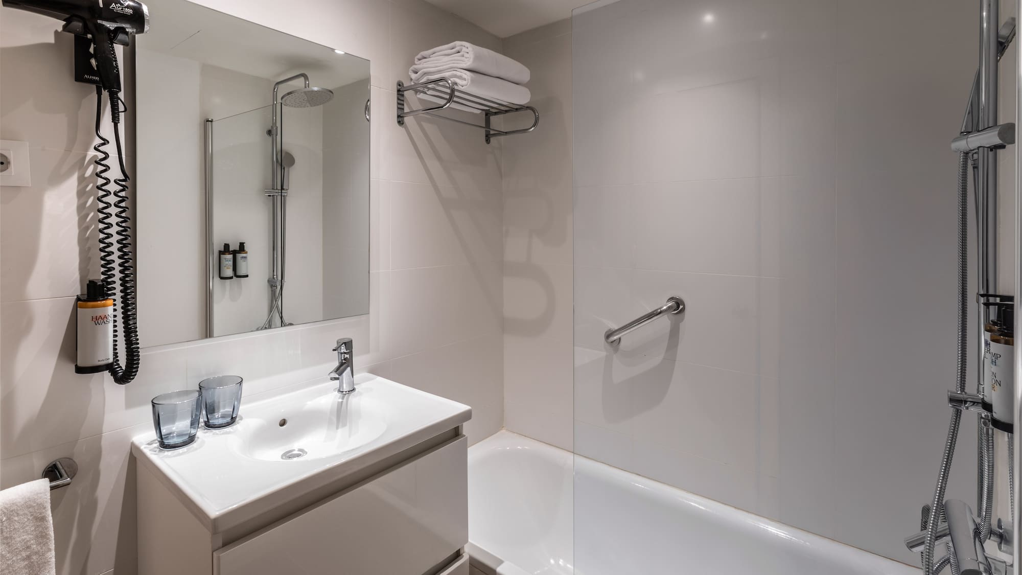 a bathroom with a shower and sink