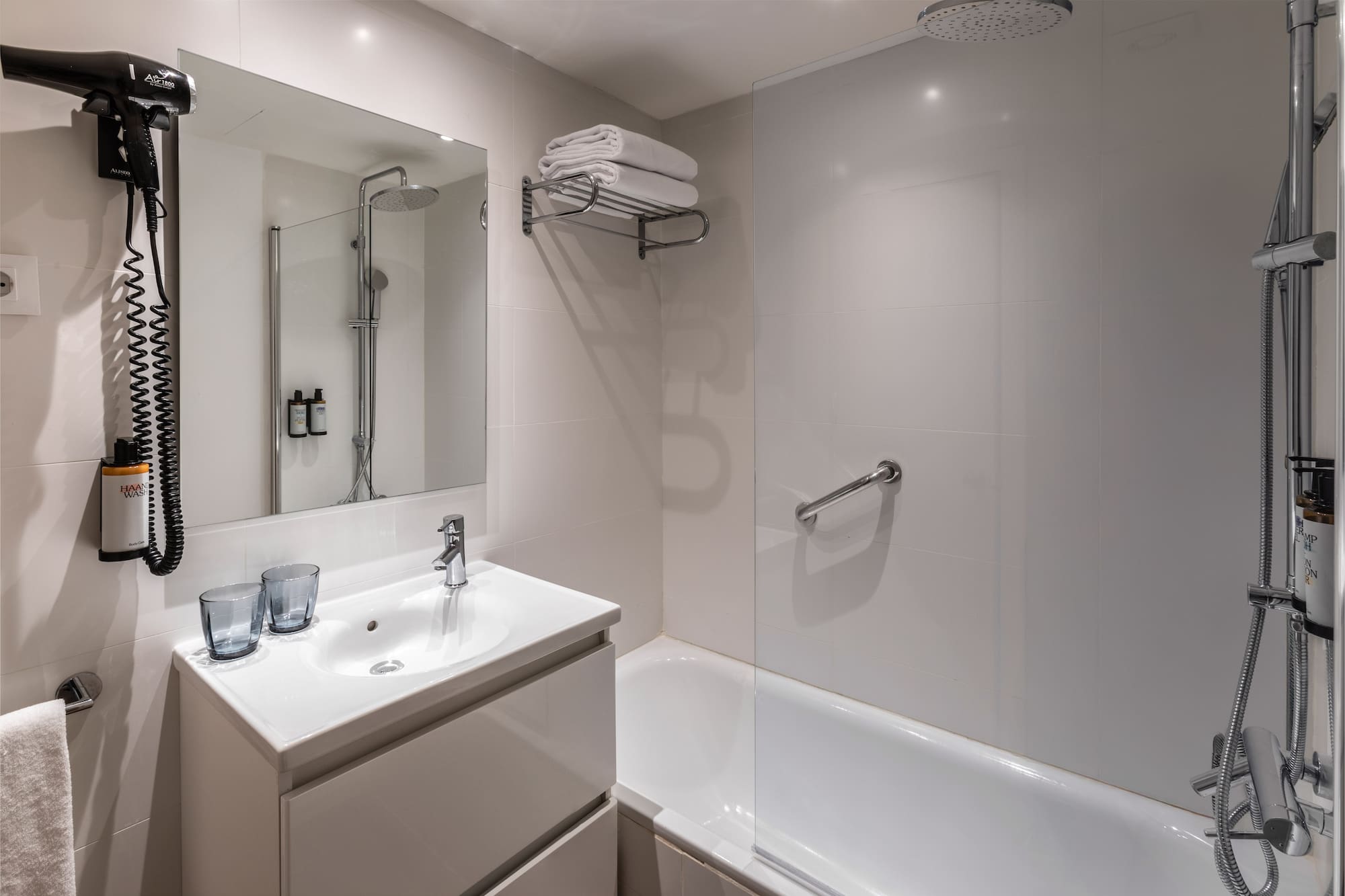 a bathroom with a shower and sink