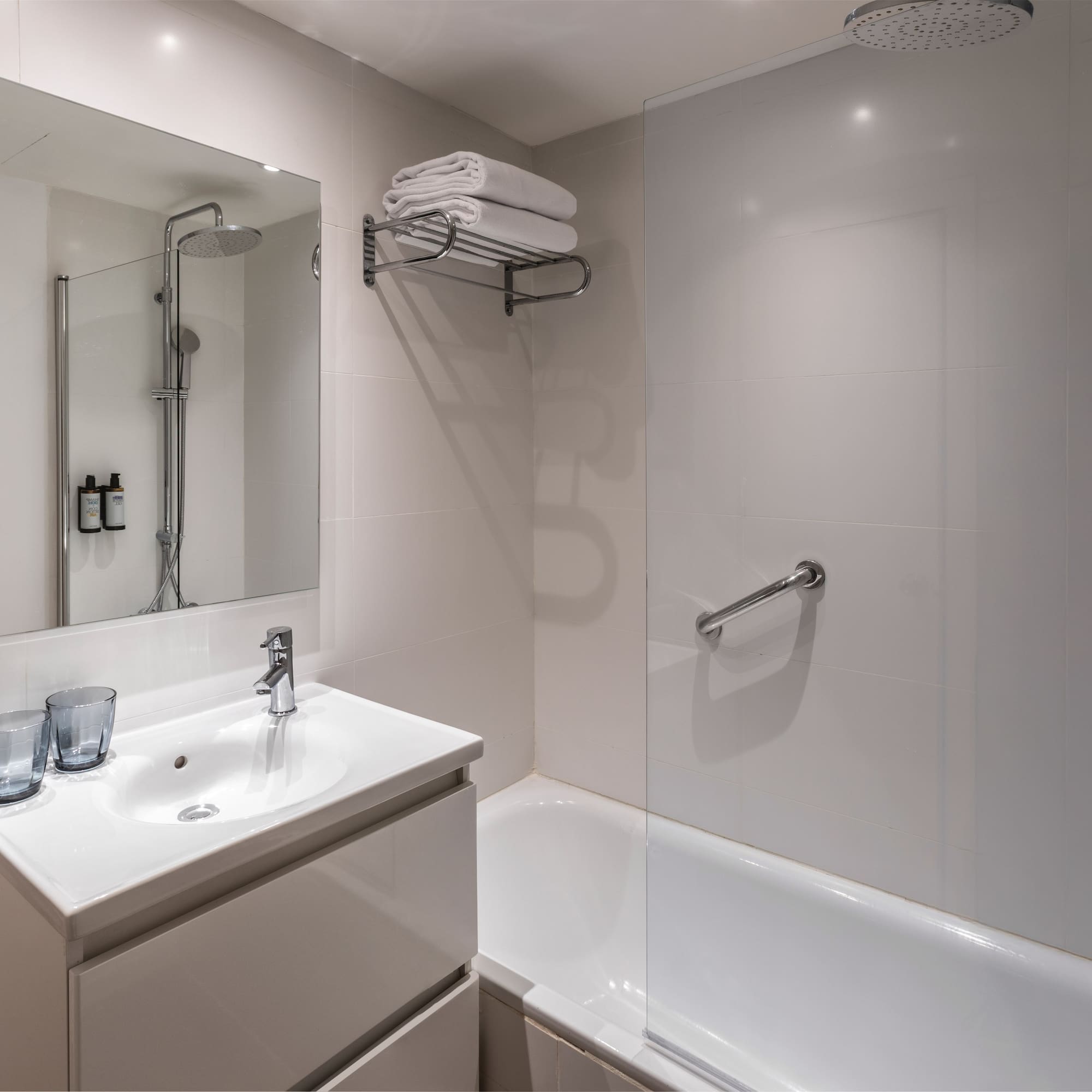 a bathroom with a shower and sink