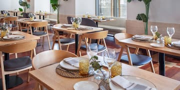 a restaurant with tables and chairs