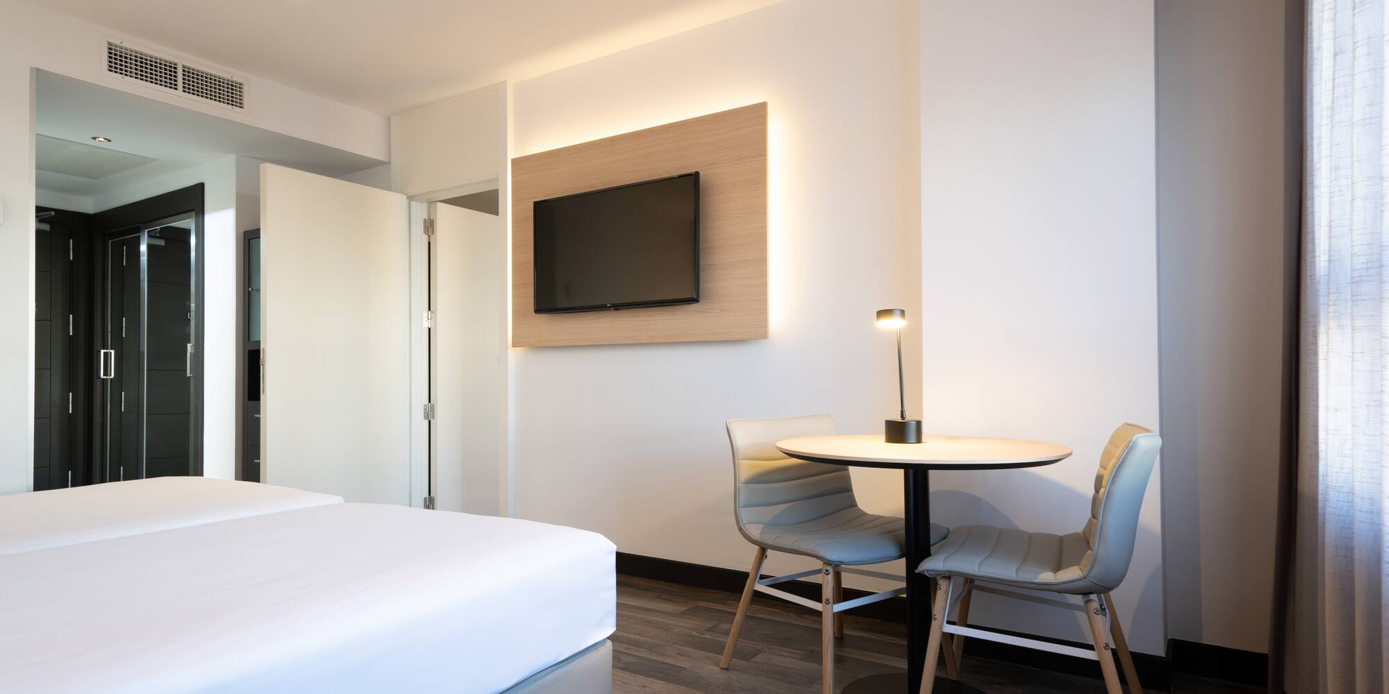 a room with a table and chairs