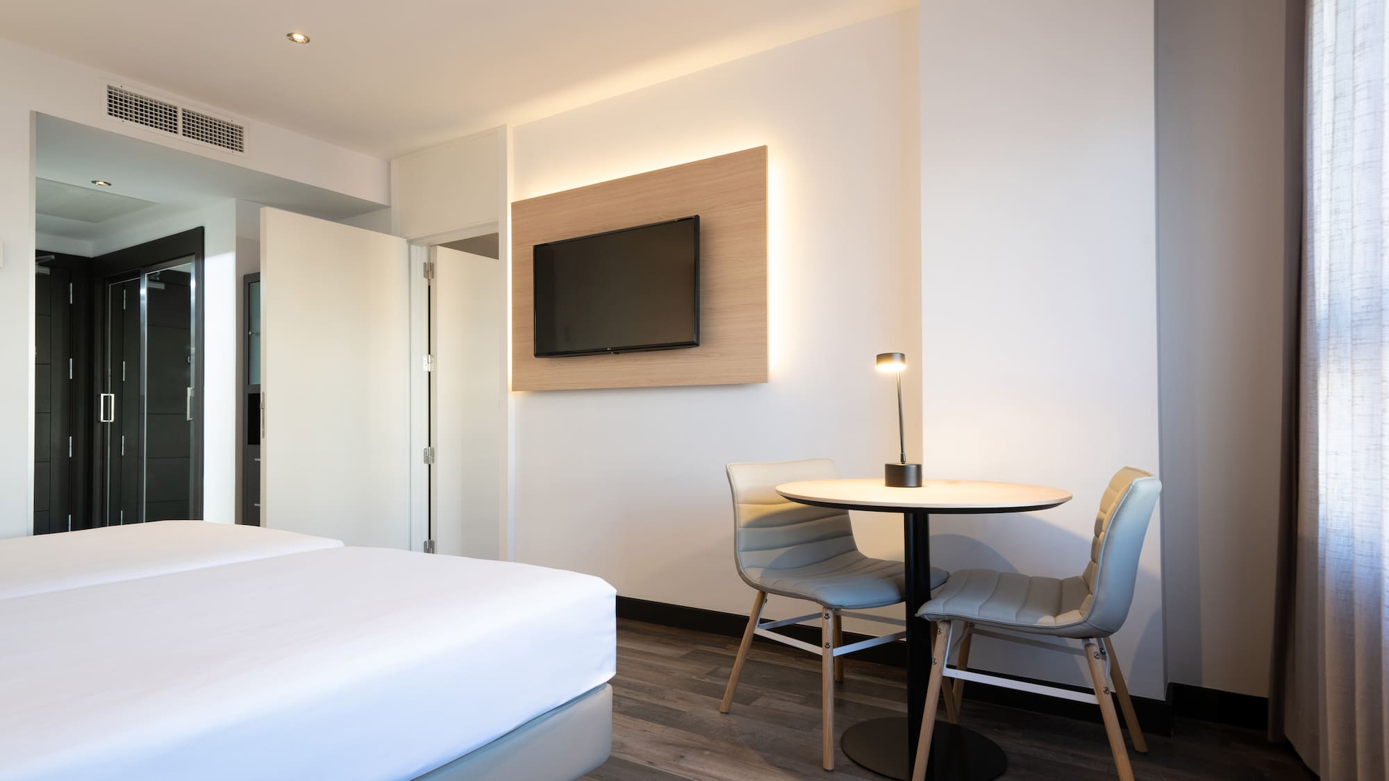 a room with a table and chairs