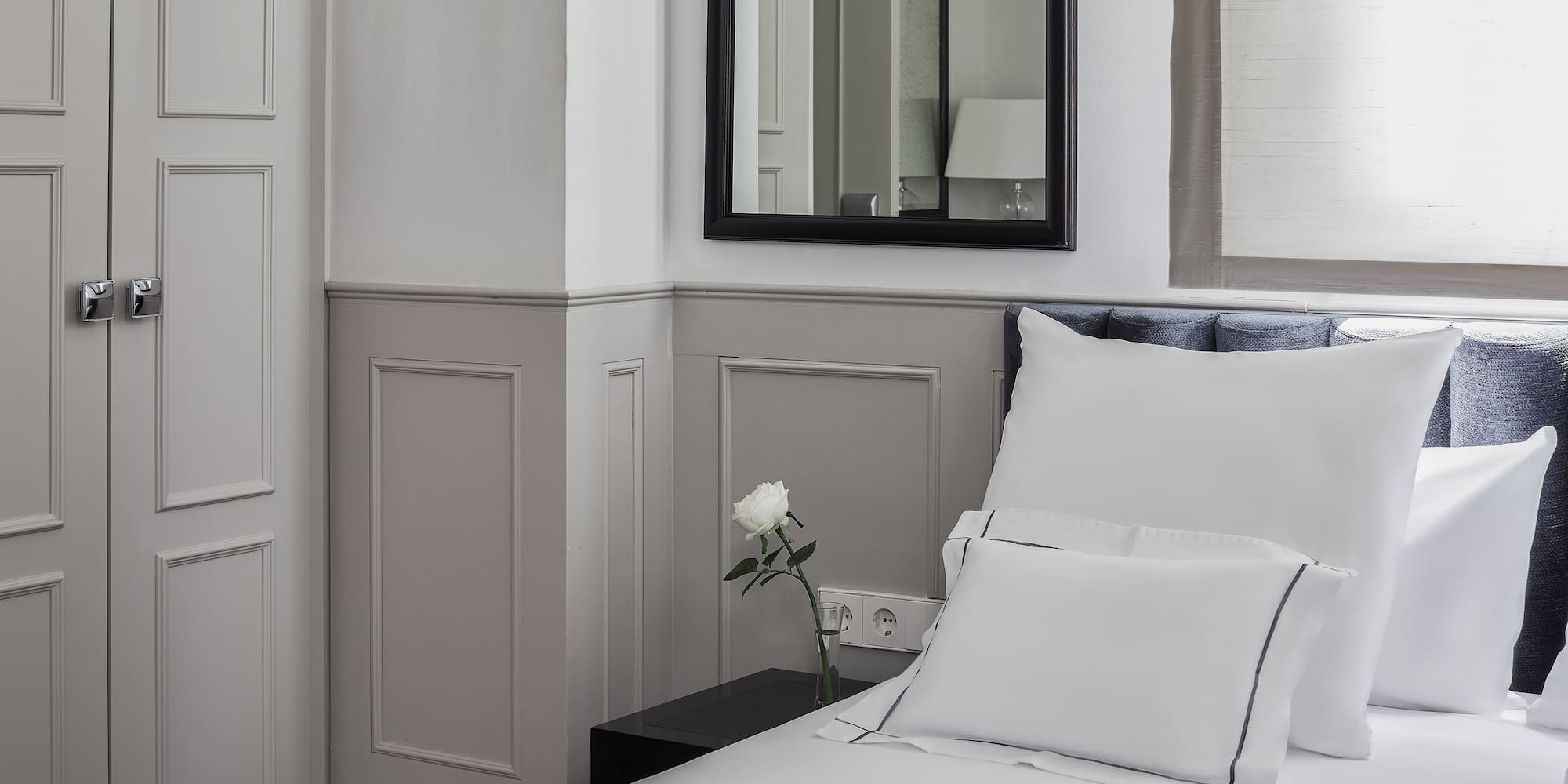 a white pillow on a bed