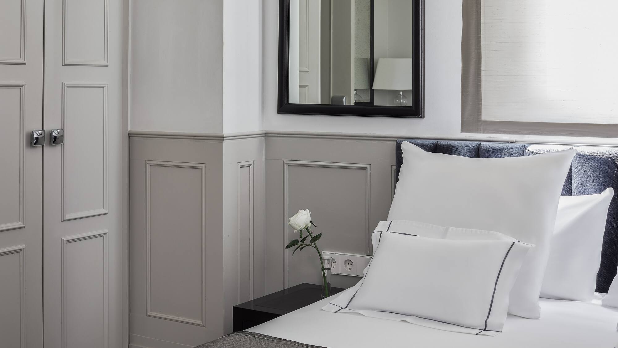 a white pillow on a bed