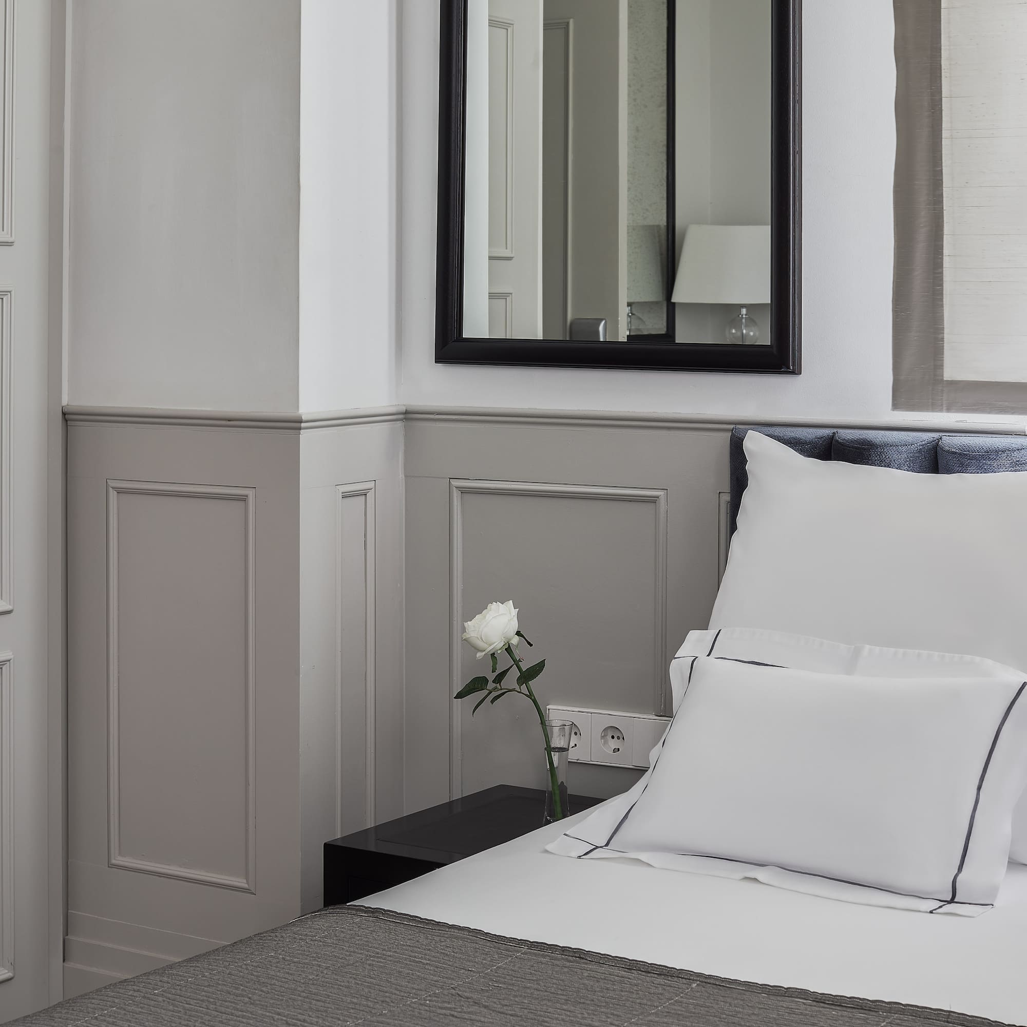 a white pillow on a bed