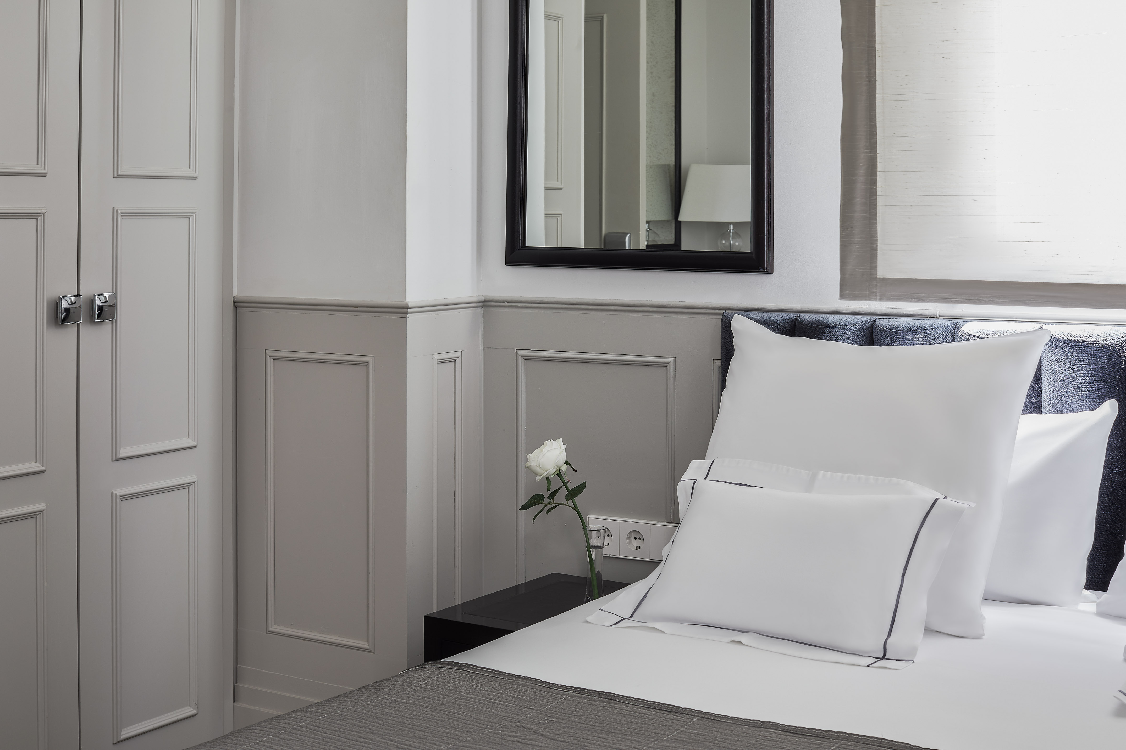 a white pillow on a bed