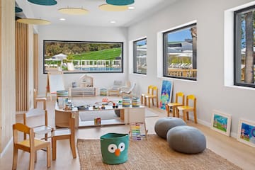 a room with a large table and chairs