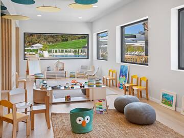 a room with a large table and chairs