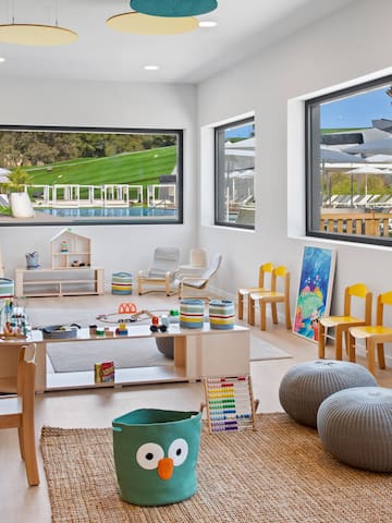 a room with a large table and chairs