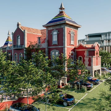 a building with trees and cars parked in front of it