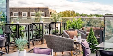 a patio with chairs and tables