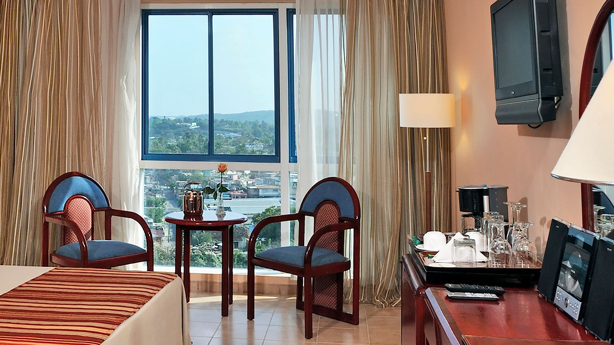 a room with a desk and chairs