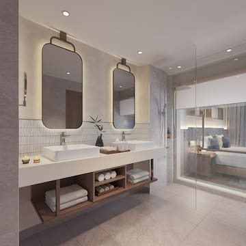 a bathroom with a double sink and mirror