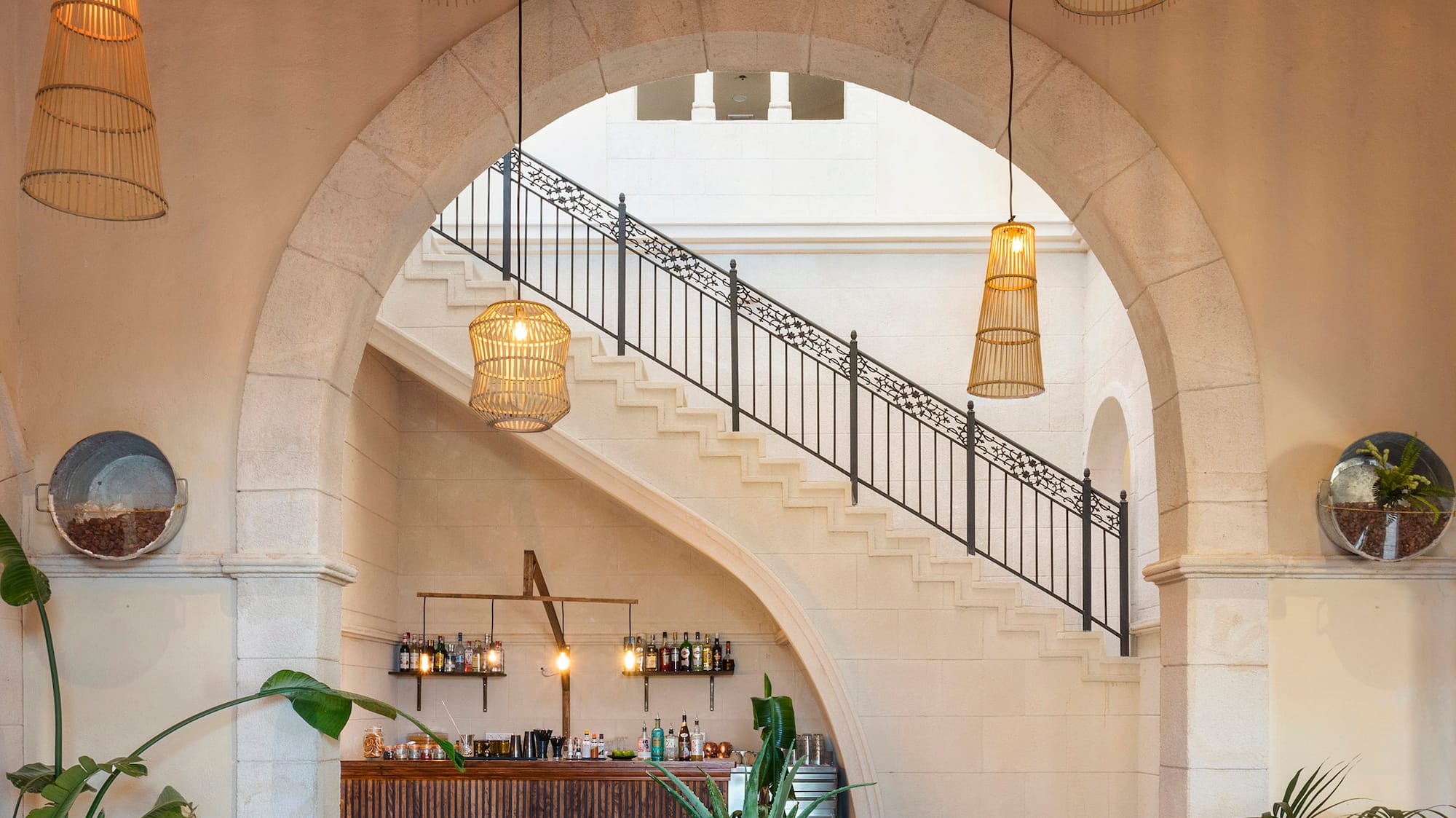 a room with a staircase and a bar