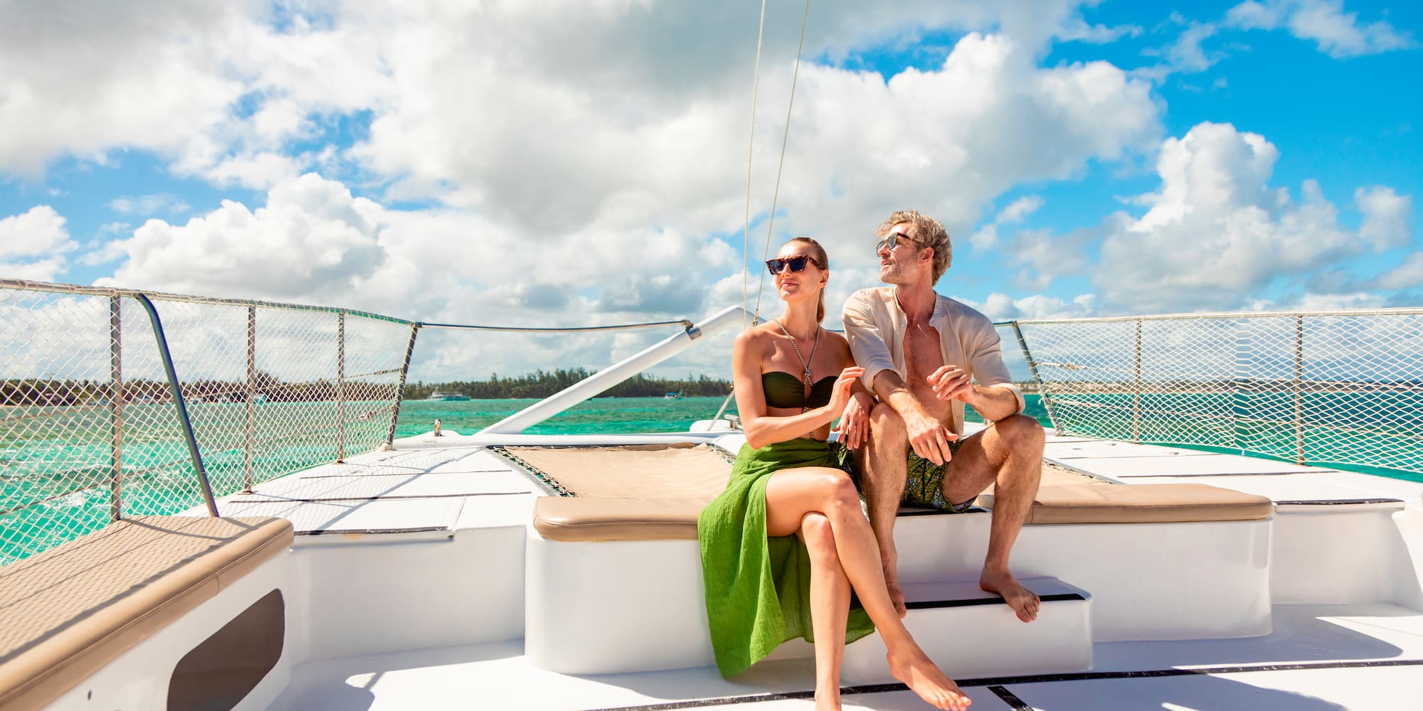 a man and woman sitting on a boat