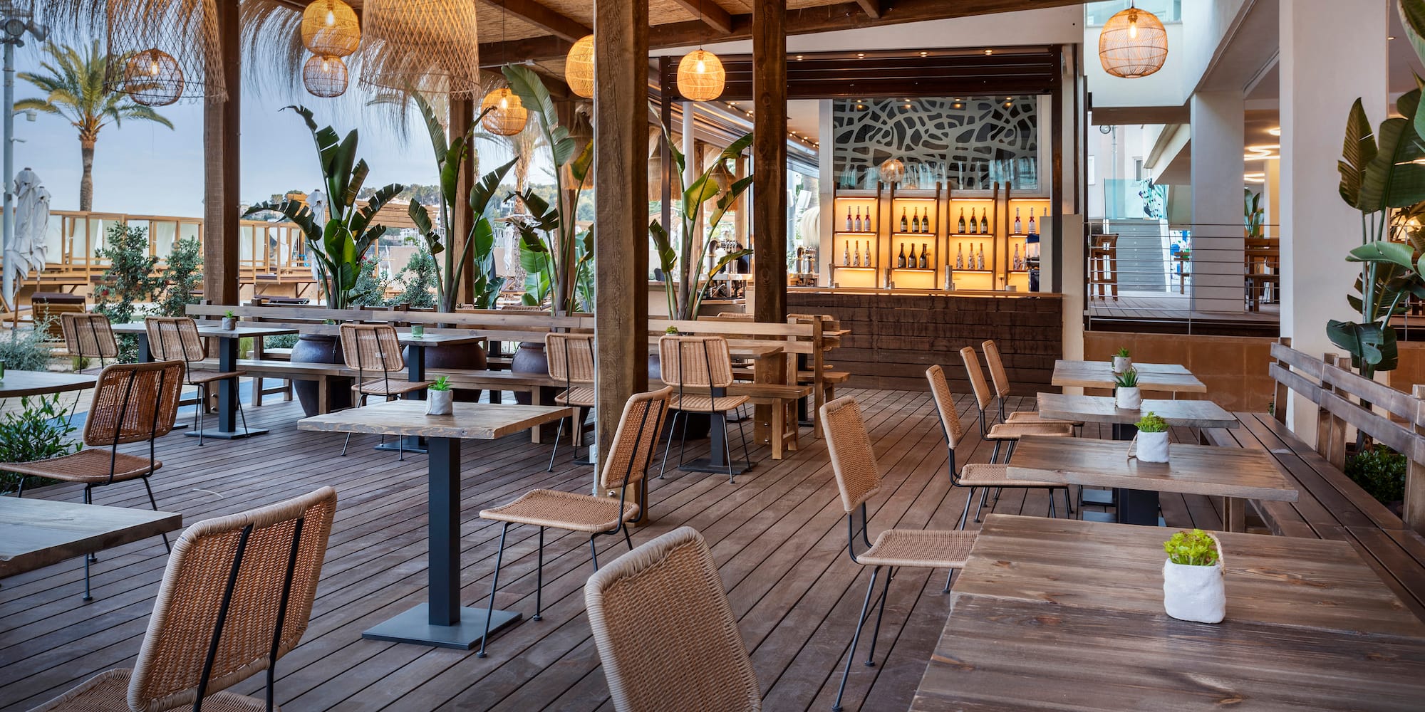 a patio with tables and chairs
