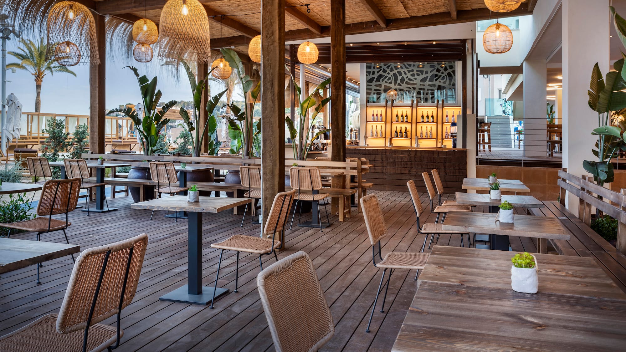 a patio with tables and chairs