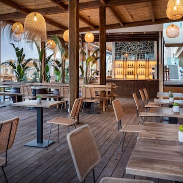 a patio with tables and chairs