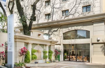 a building with a tree in front of it