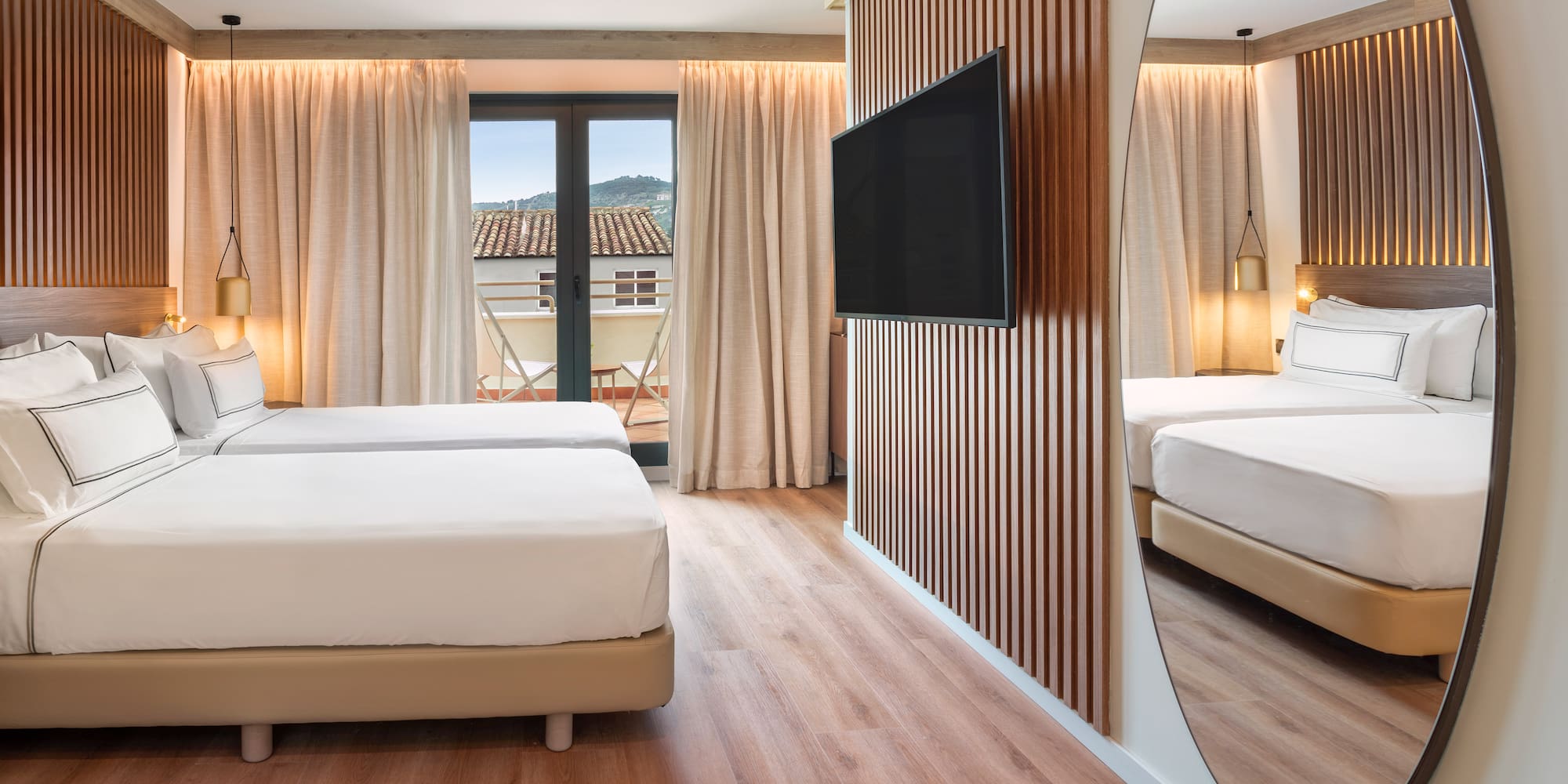 a room with a mirror and a bed