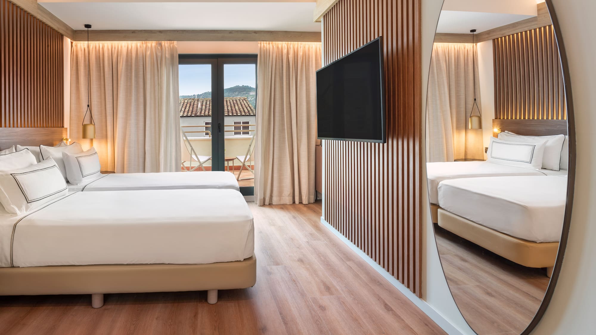 a room with a mirror and a bed