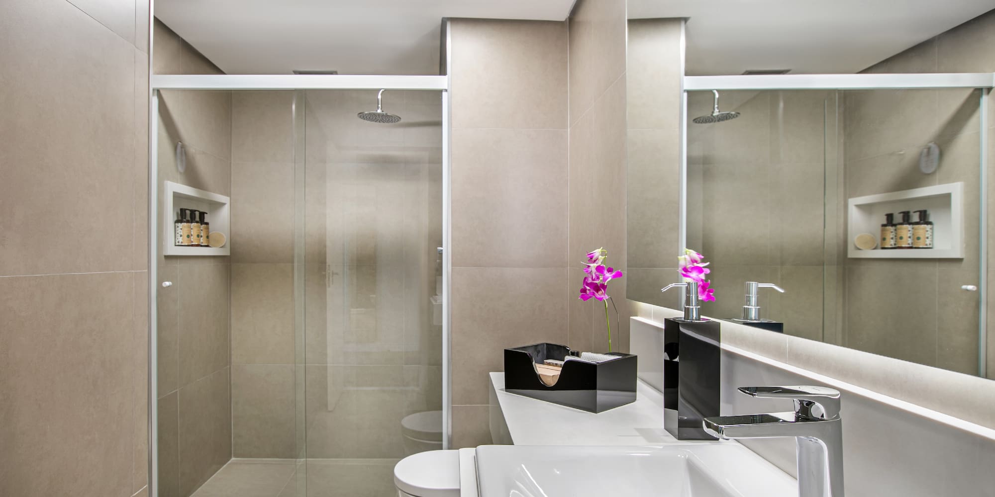 a bathroom with a shower and sink