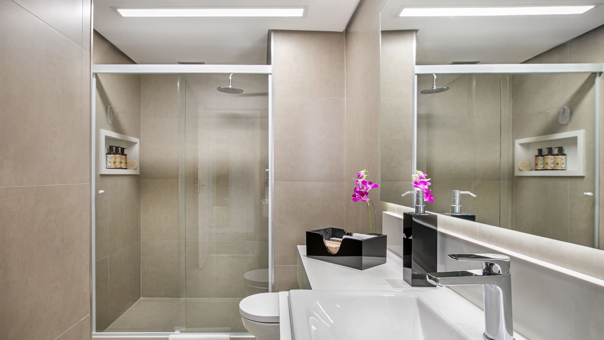 a bathroom with a shower and sink