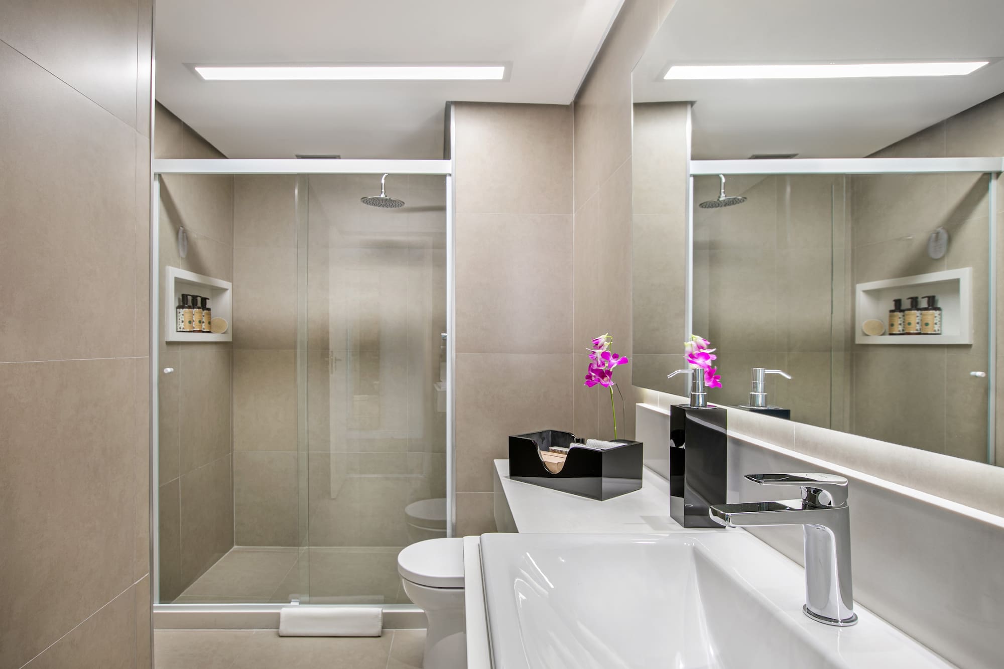 a bathroom with a shower and sink