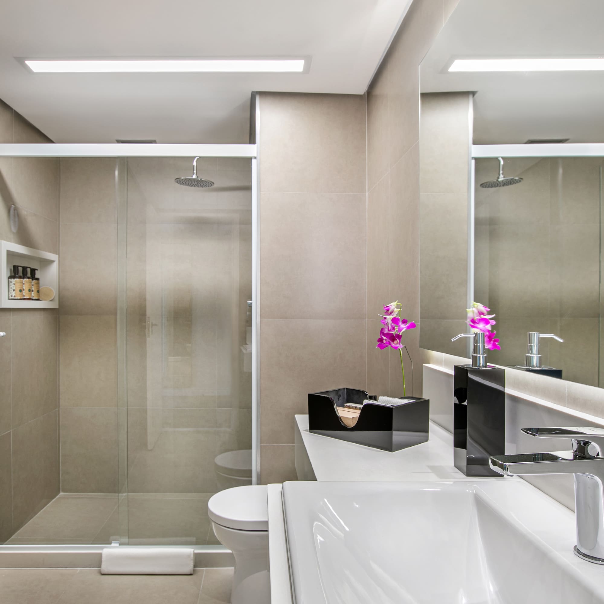 a bathroom with a shower and sink