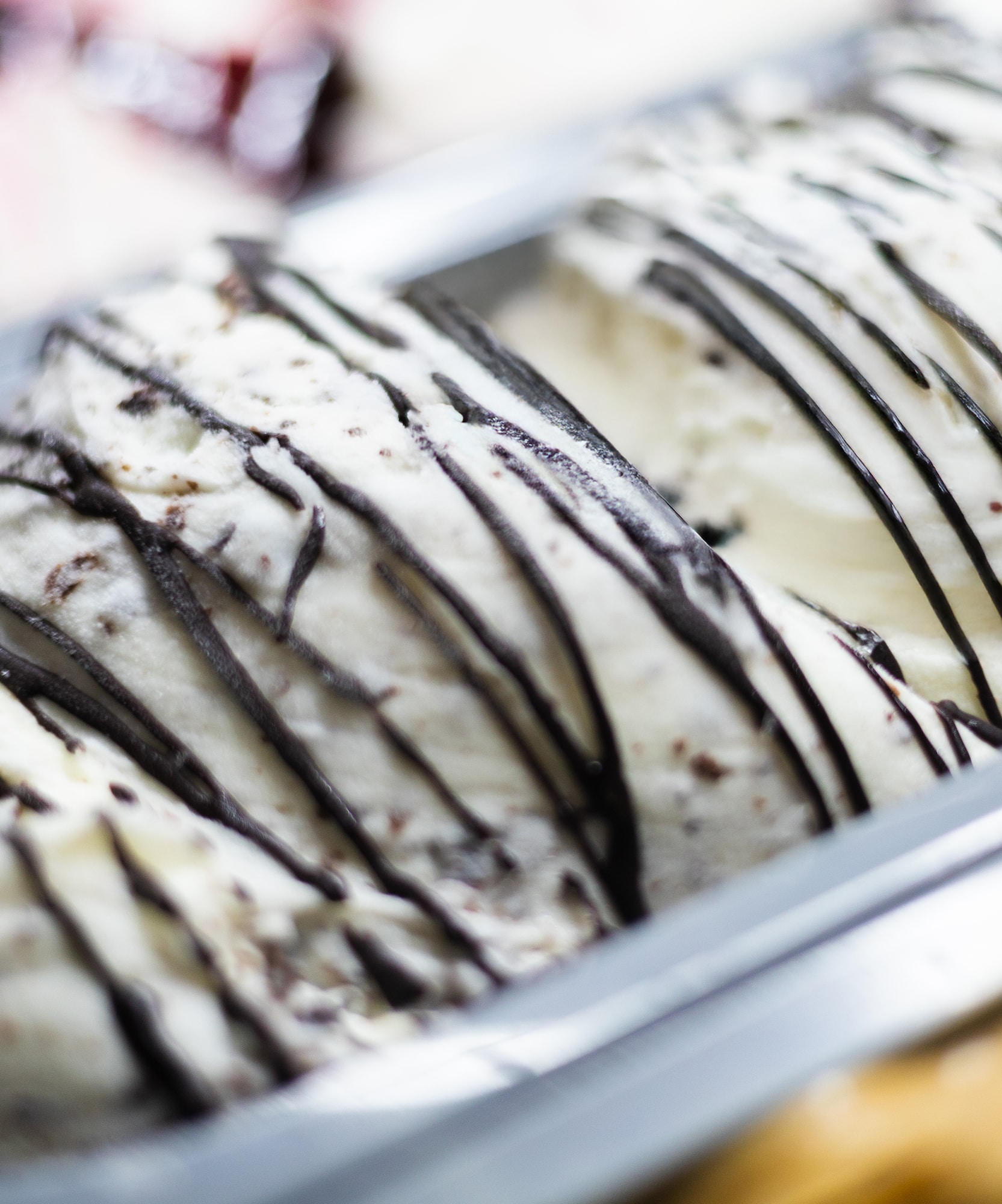 Creamy cookies and cream ice cream with dark chocolate drizzle.
