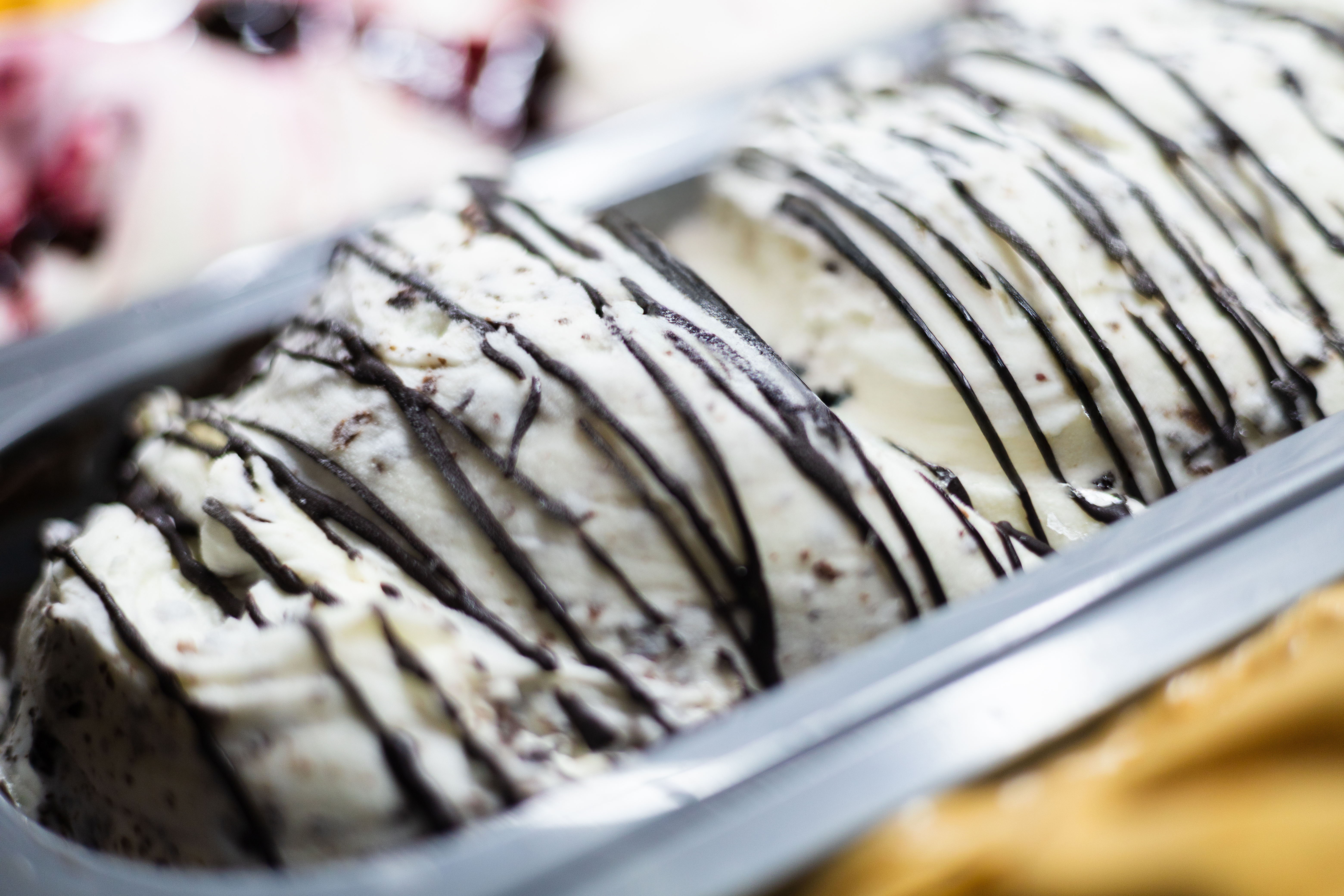Creamy cookies and cream ice cream with dark chocolate drizzle.
