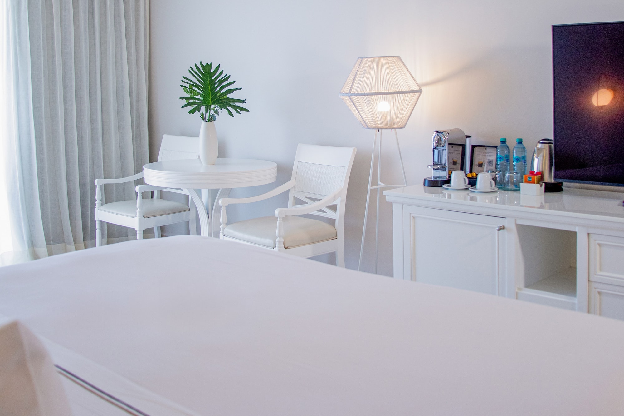 a room with a television and a table