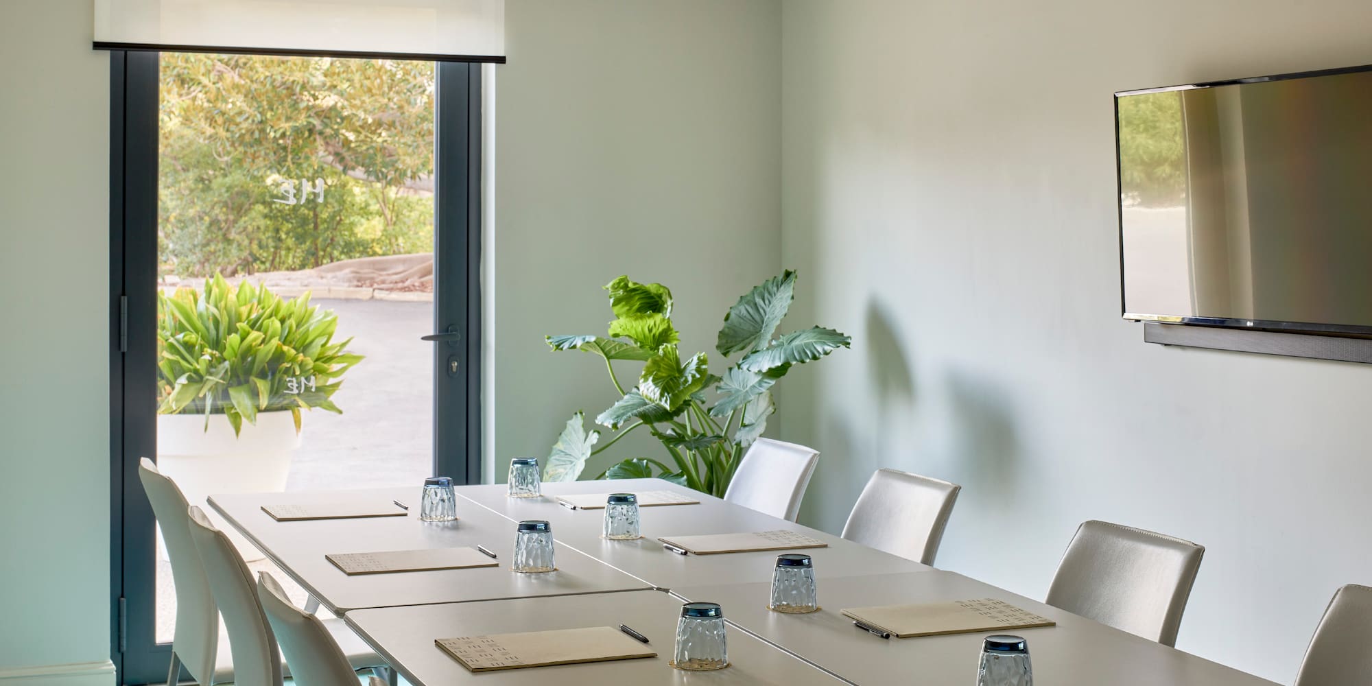 a conference room with a table and chairs