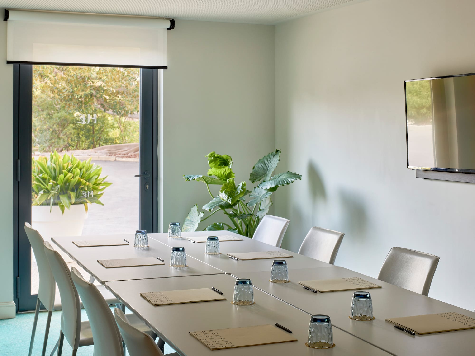 a conference room with a table and chairs