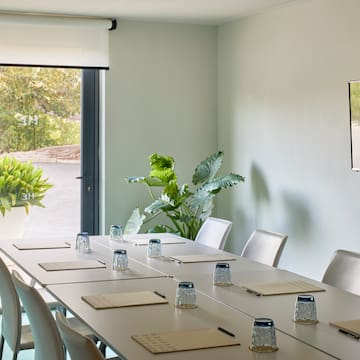 a conference room with a table and chairs