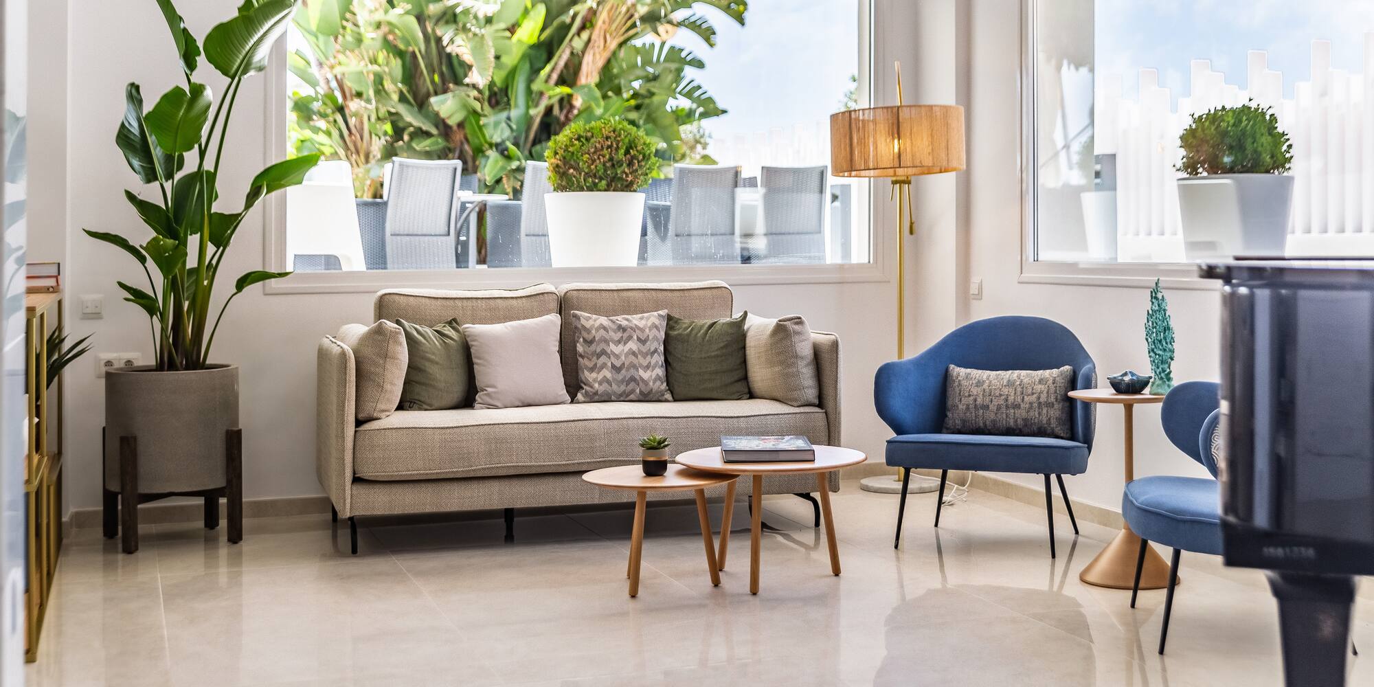 a living room with a couch and chairs