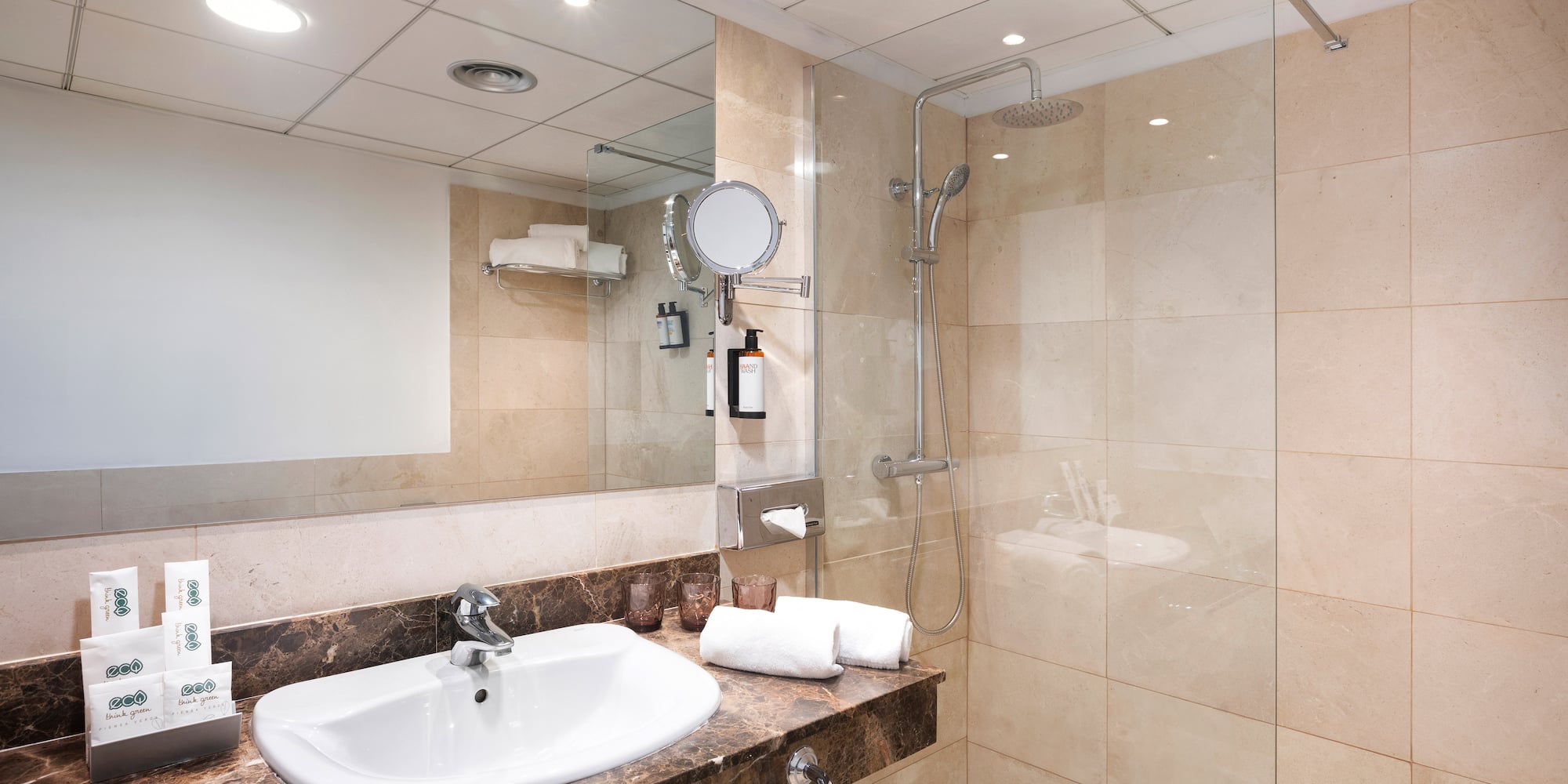 a bathroom with a shower and sink