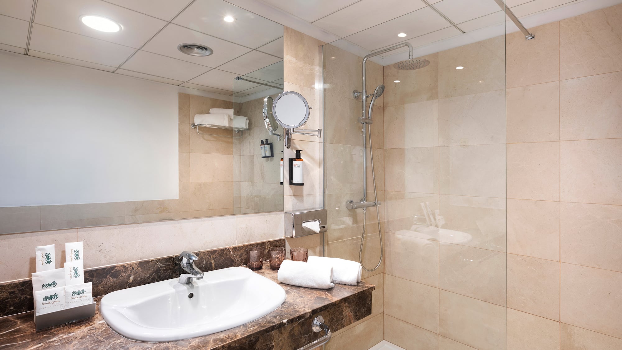 a bathroom with a shower and sink