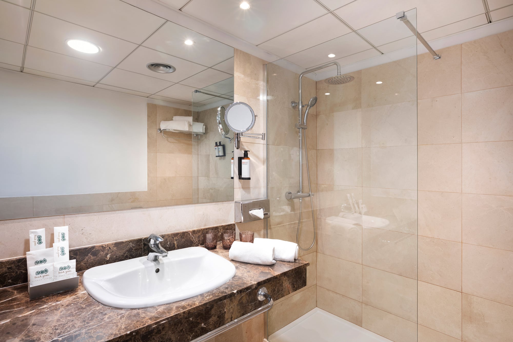 a bathroom with a shower and sink