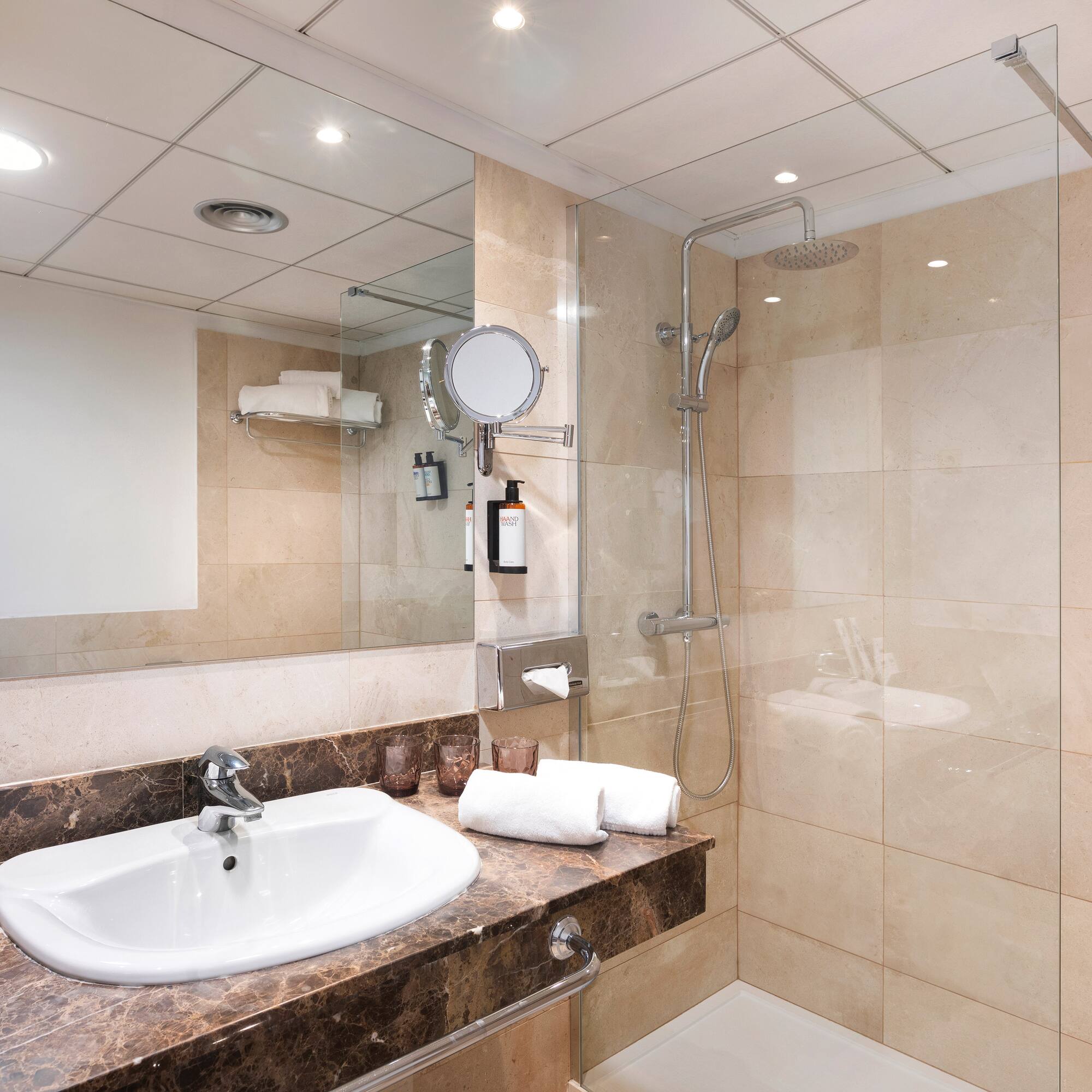 a bathroom with a shower and sink