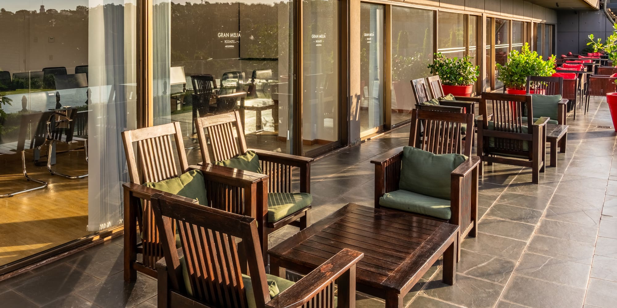 a patio with chairs and tables