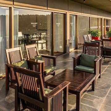a patio with chairs and tables
