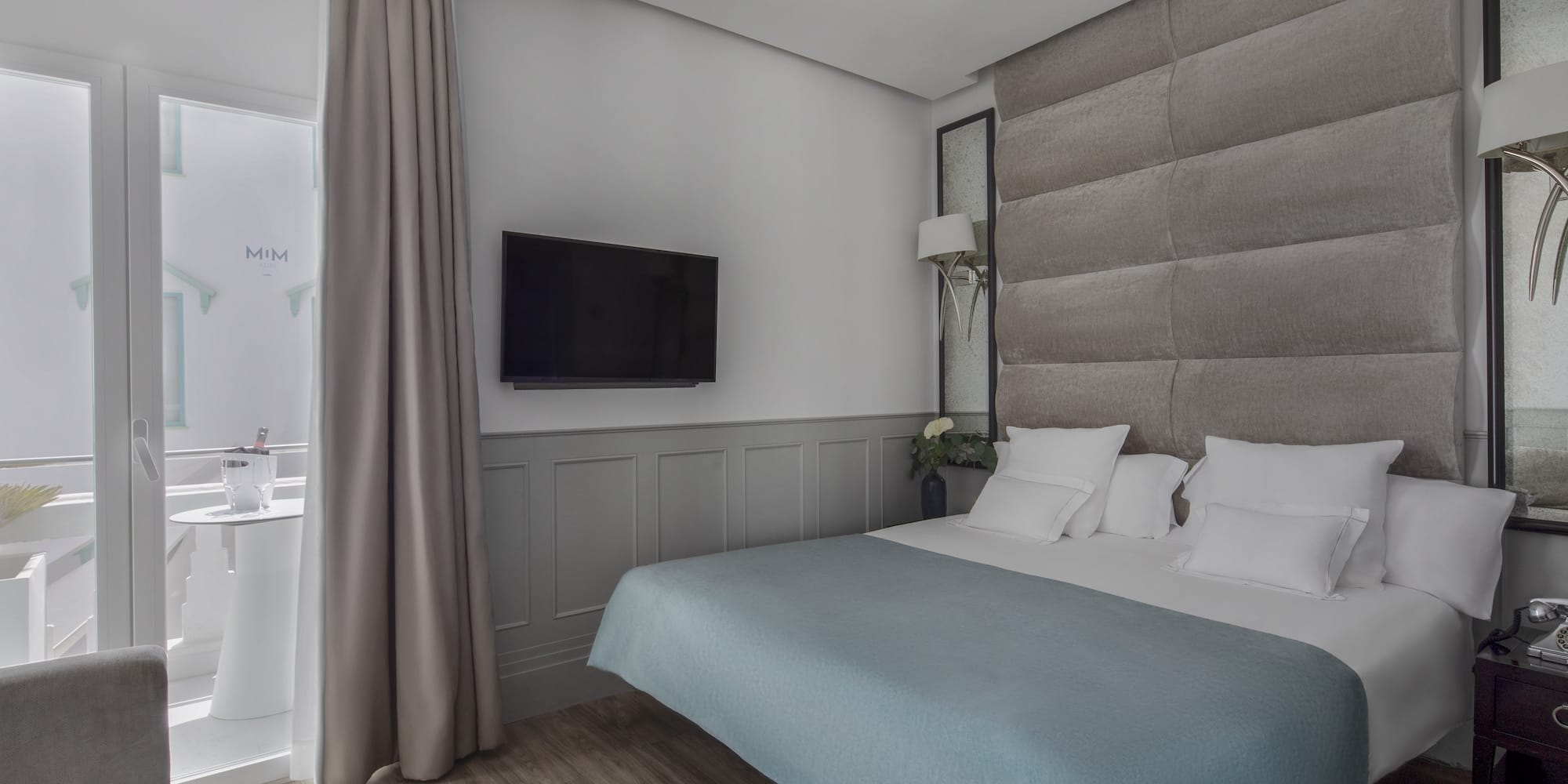 a bed with a tv in a room