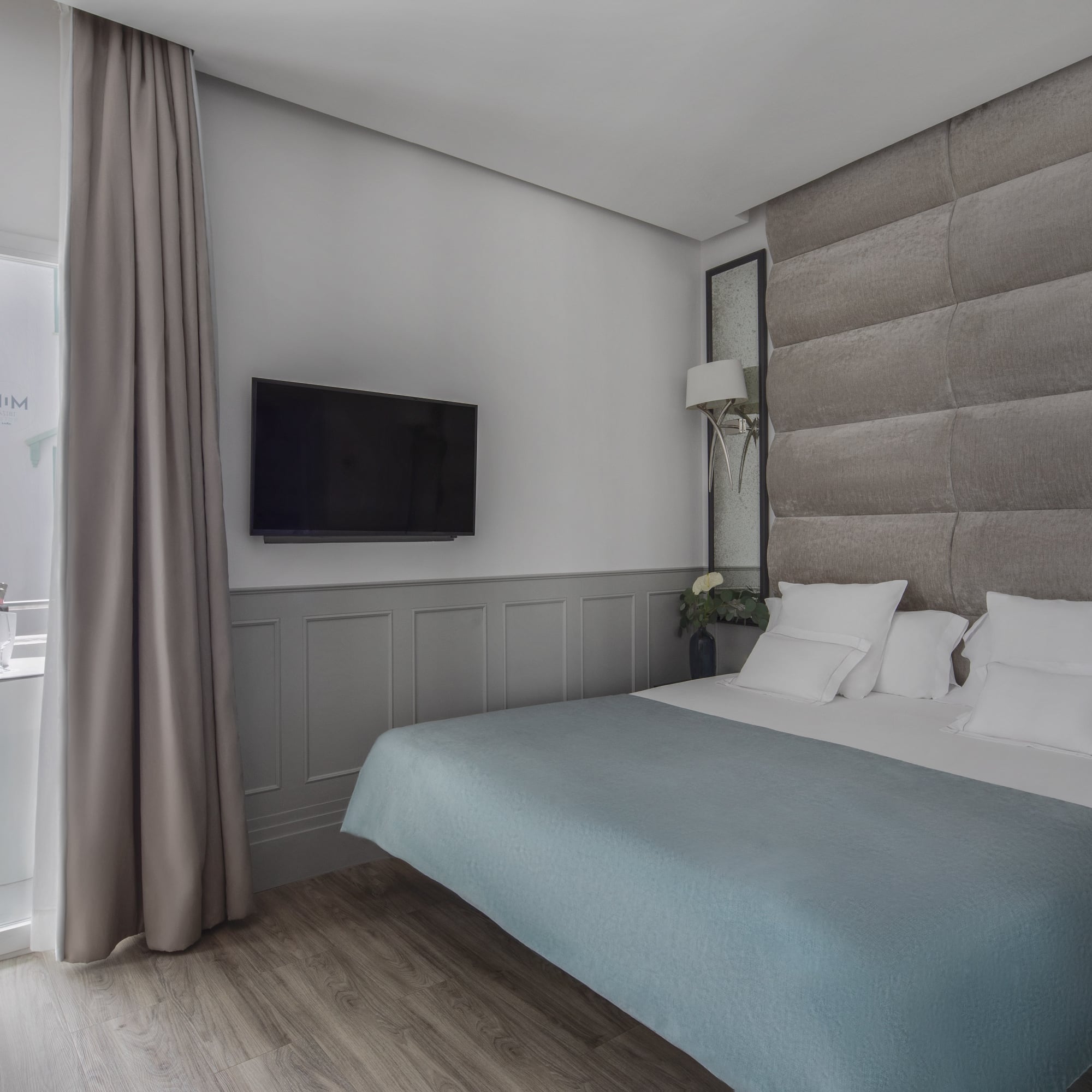 a bed with a tv in a room